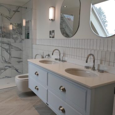 In the Clouds, attic en-suite double vanity, toilet and bath